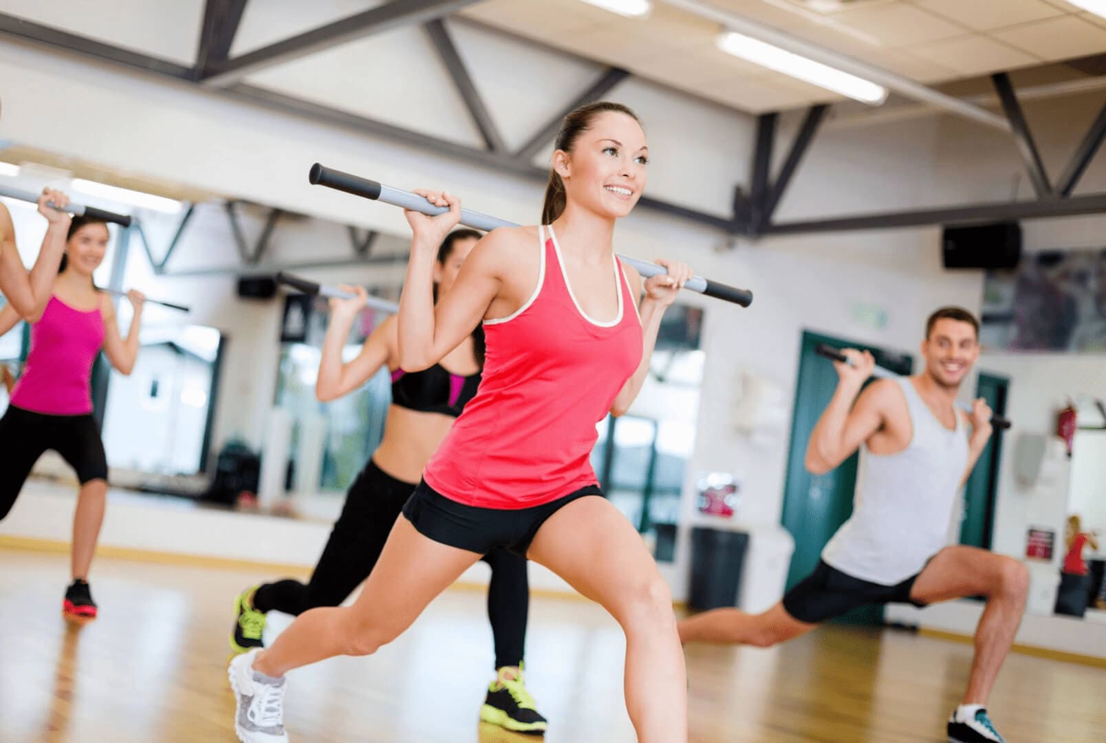 Group workout with weights in a gym.